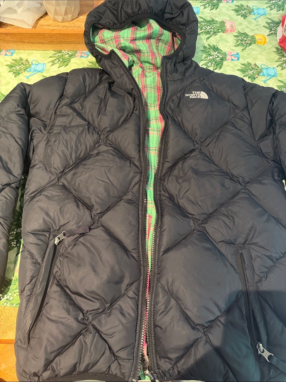 The North Face Women’s Black Puffer Jacket with Green Plaid Lining